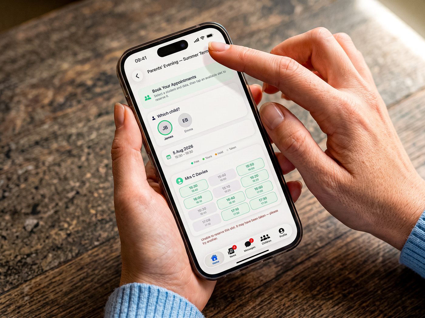 A parent booking a parents&rsquo; evening slot in the Parent & Carer app