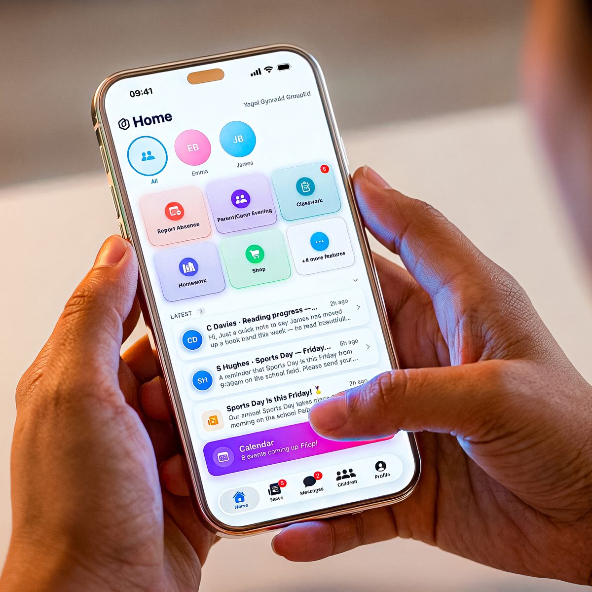 A parent&rsquo;s hand holding a phone showing the Parent & Carer app home screen